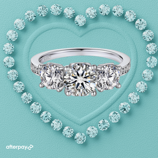 Moissanite engagement ring with three stones, heart diamond border, Fire & Ice jewelry