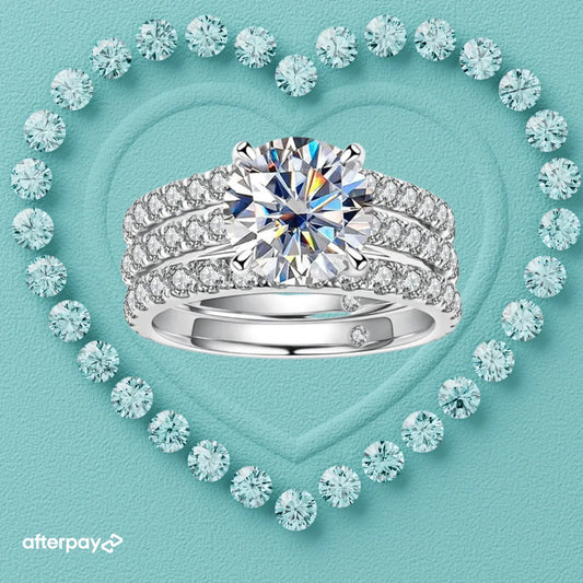 moissanite triple ring set Diamond ring with a heart-shaped arrangement of diamonds on a light blue background, featuring the Afterpay logo.