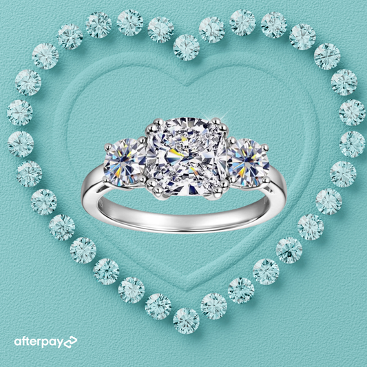 Cushion cut moissanite ring with sparkling side stones and elegant setting