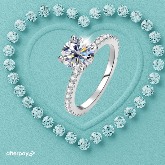 Juliette Hidden Halo Ring featuring a 1 carat round moissanite in a four-prong setting with pavé band and hidden halo detail.