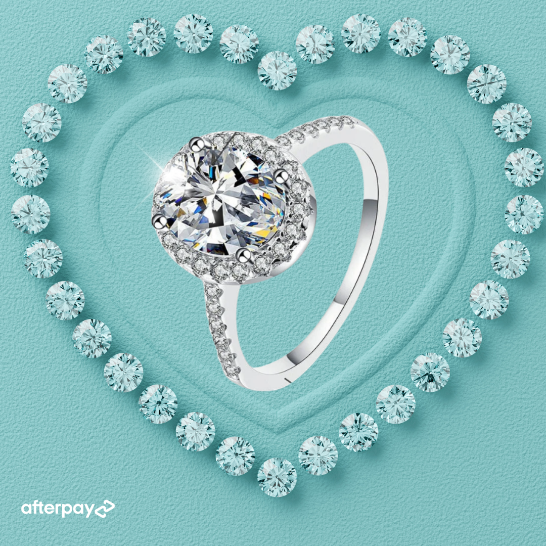 moissanite diamond ring with oval halo on a turquoise background withAfterpay logo.