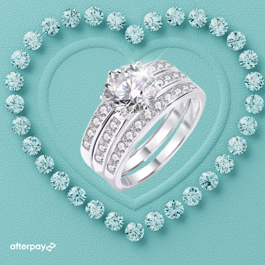 Silver ring with gemstones on a turquoise background, featuring the Afterpay logo.