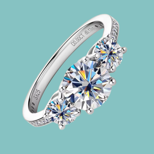 Fire & Ice Moissanite three-stone ring with brilliant round stones on a silver band