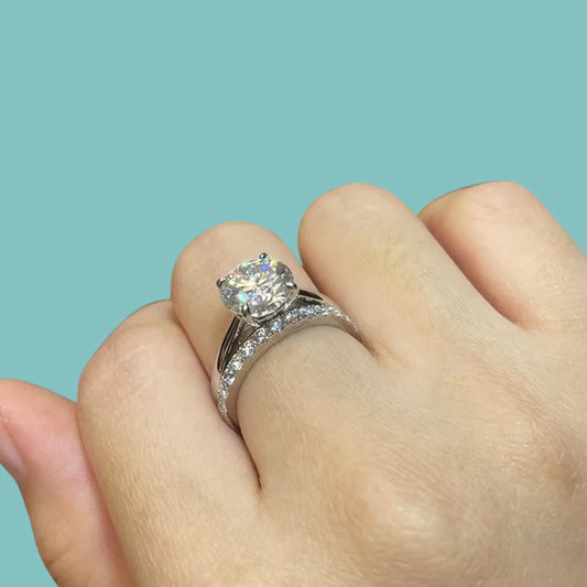 Fire & Ice Moissanite engagement ring on hand with diamond-like brilliance, silver band