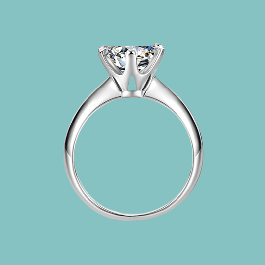 Dainty round moissanite solitaire ring with six claw setting