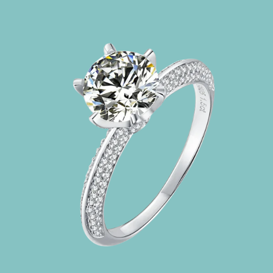 Knife edge moissanite ring with delicate pavé set band