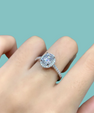 Oval halo moissanite ring with brilliant centre stone and pavé shank