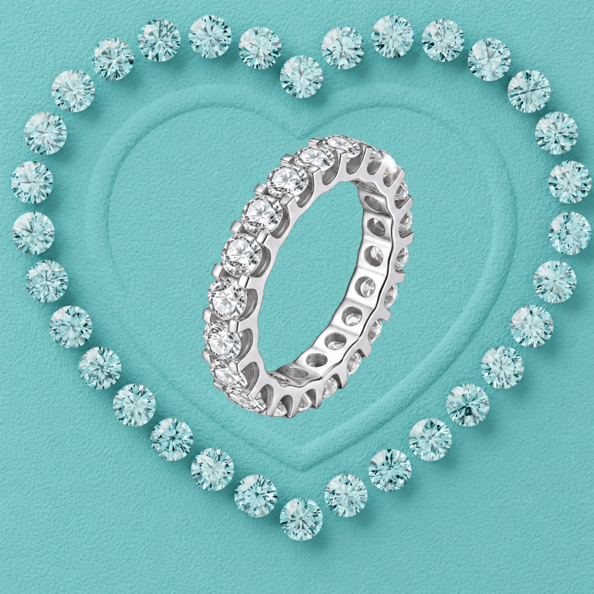 A silver eternity ring set with clear round-cut gemstones, presented on a textured turquoise background with a heart outline formed by matching stones.