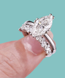 Marquise moissanite engagement ring with coordinating contoured band