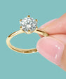 Classic knife edge engagement ring with six claw moissanite setting