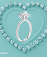 Hidden halo round moissanite ring with brilliant centre stone and elegant pavé band