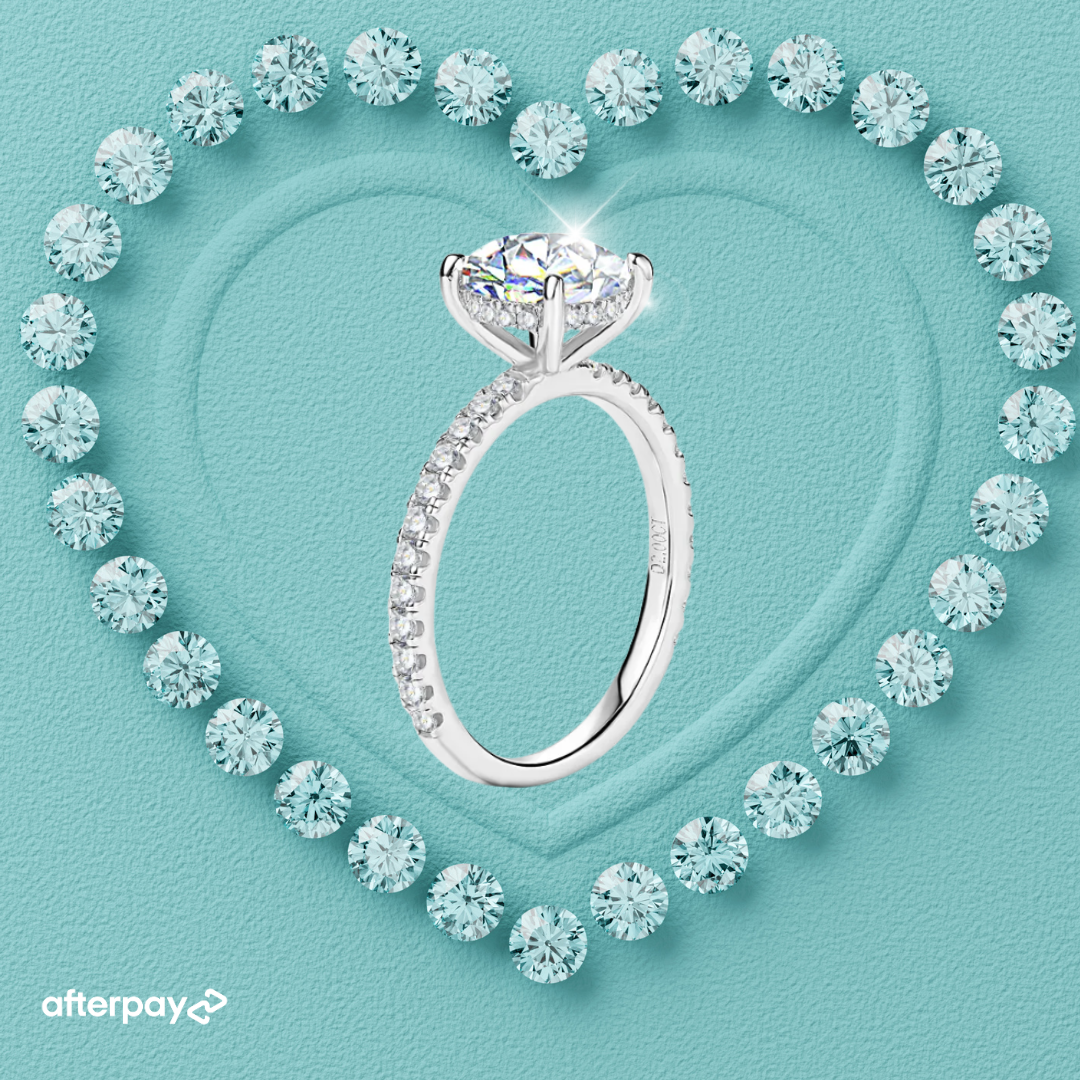 Hidden halo round moissanite ring with brilliant centre stone and elegant pavé band