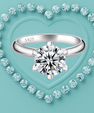 A silver solitaire engagement ring with a round brilliant-cut diamond, featuring an 'S925' hallmark on the inner band. The ring is centered against a textured light blue background, framed by a heart-shaped border of small sparkling diamonds.