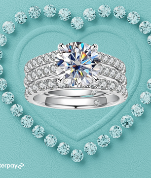 moissanite triple ring set Diamond ring with a heart-shaped arrangement of diamonds on a light blue background, featuring the Afterpay logo.