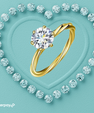 Yellow gold moissanite ring with round brilliant centre stone