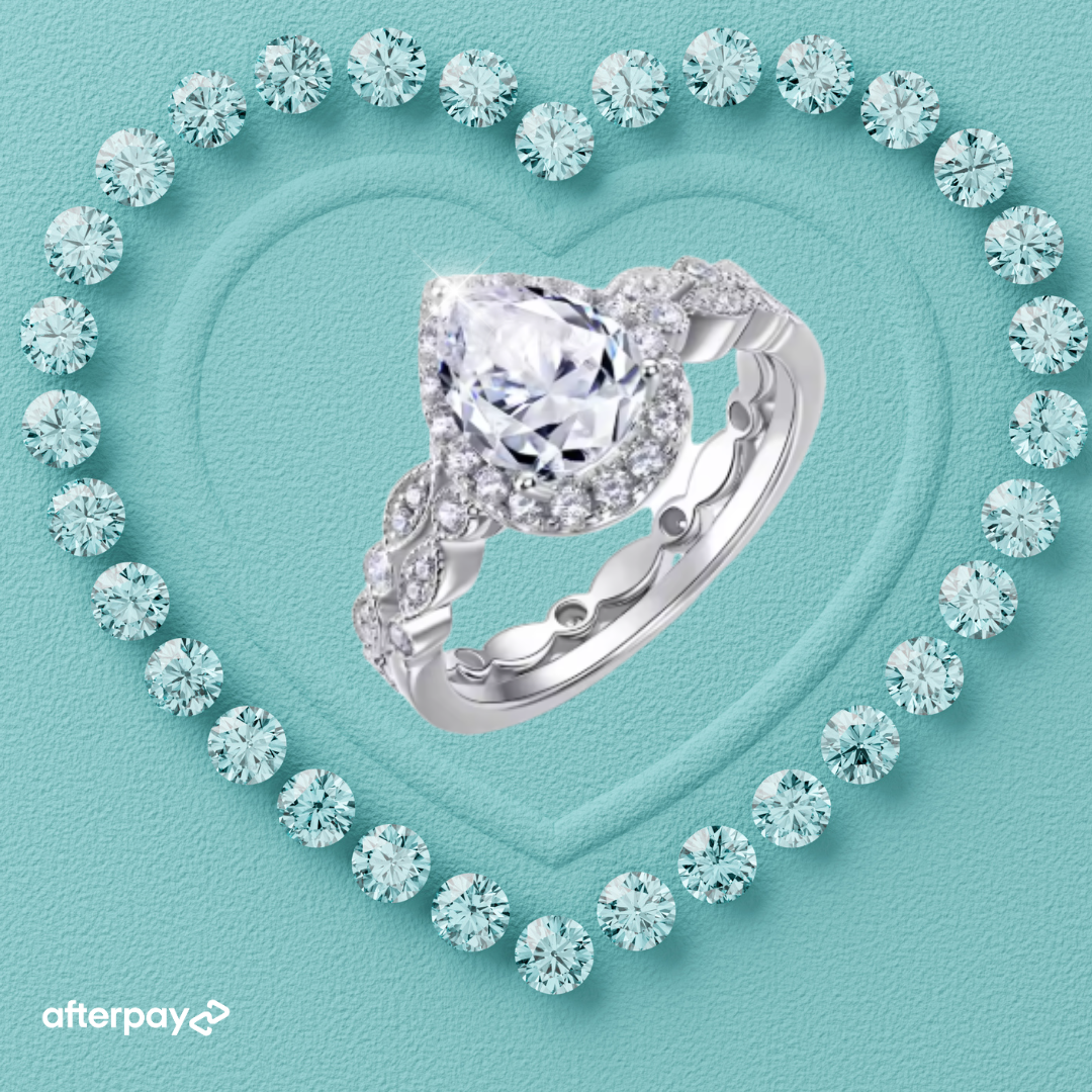 Pear moissanite ring set with sparkling teardrop centre stone and matching pavé wedding band
