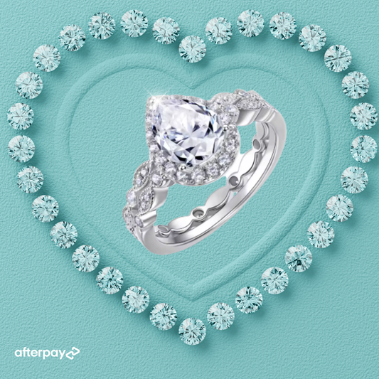 Pear moissanite ring set with sparkling teardrop centre stone and matching pavé wedding band