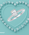 Diamond ring with 'Afterpay' logo on a turquoise background