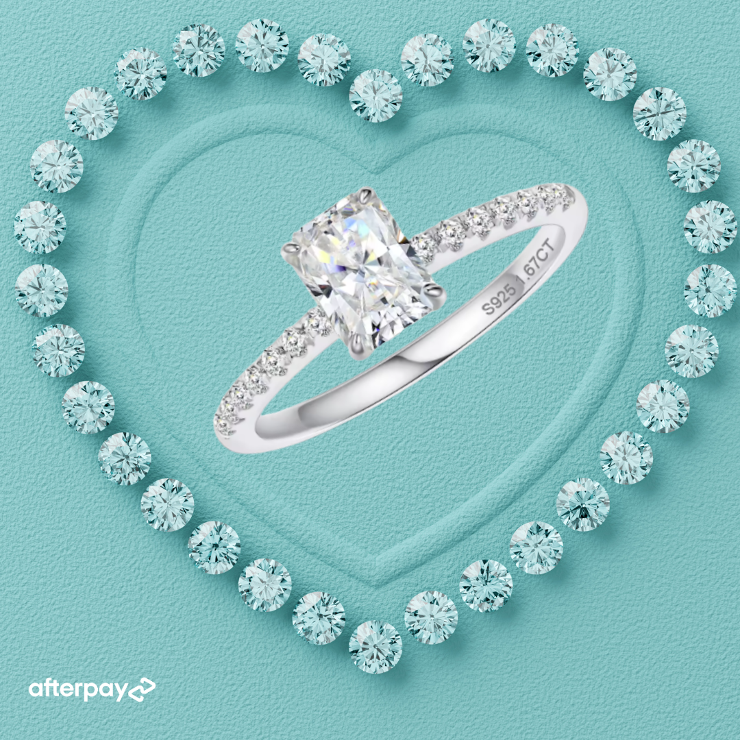 Diamond ring with 'Afterpay' logo on a turquoise background