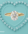 Oval cut moissanite ring with slim white gold solitaire band.