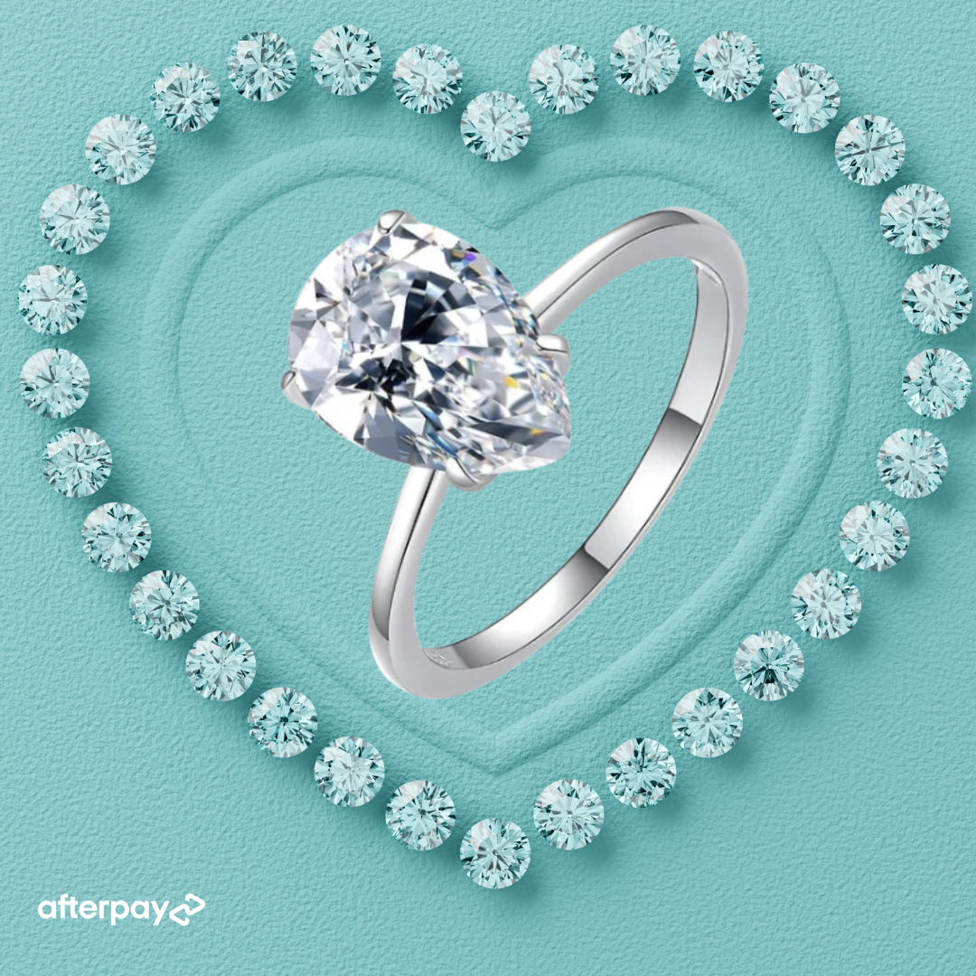 1 carat pear cut moissanite solitaire ring on a 14k gold filled band