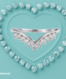 ela moissanite V-shaped wedding band with sparkling stones in a silver-toned setting