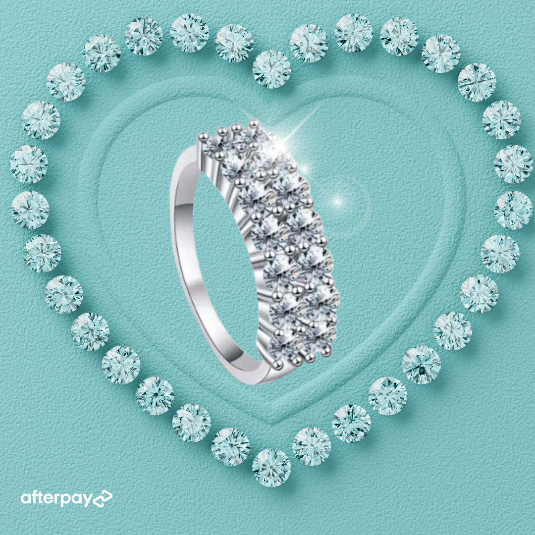 Celina wide pavé moissanite band with rows of sparkling round stones in a silver setting.