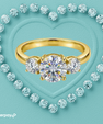 Round three stone moissanite ring with 1 carat centre stone available in gold or silver