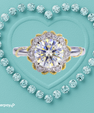 Isolde round moissanite ring with ornate vintage inspired halo and two-tone detailing