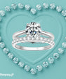 Round moissanite ring set with pavé wedding band in sterling silver
