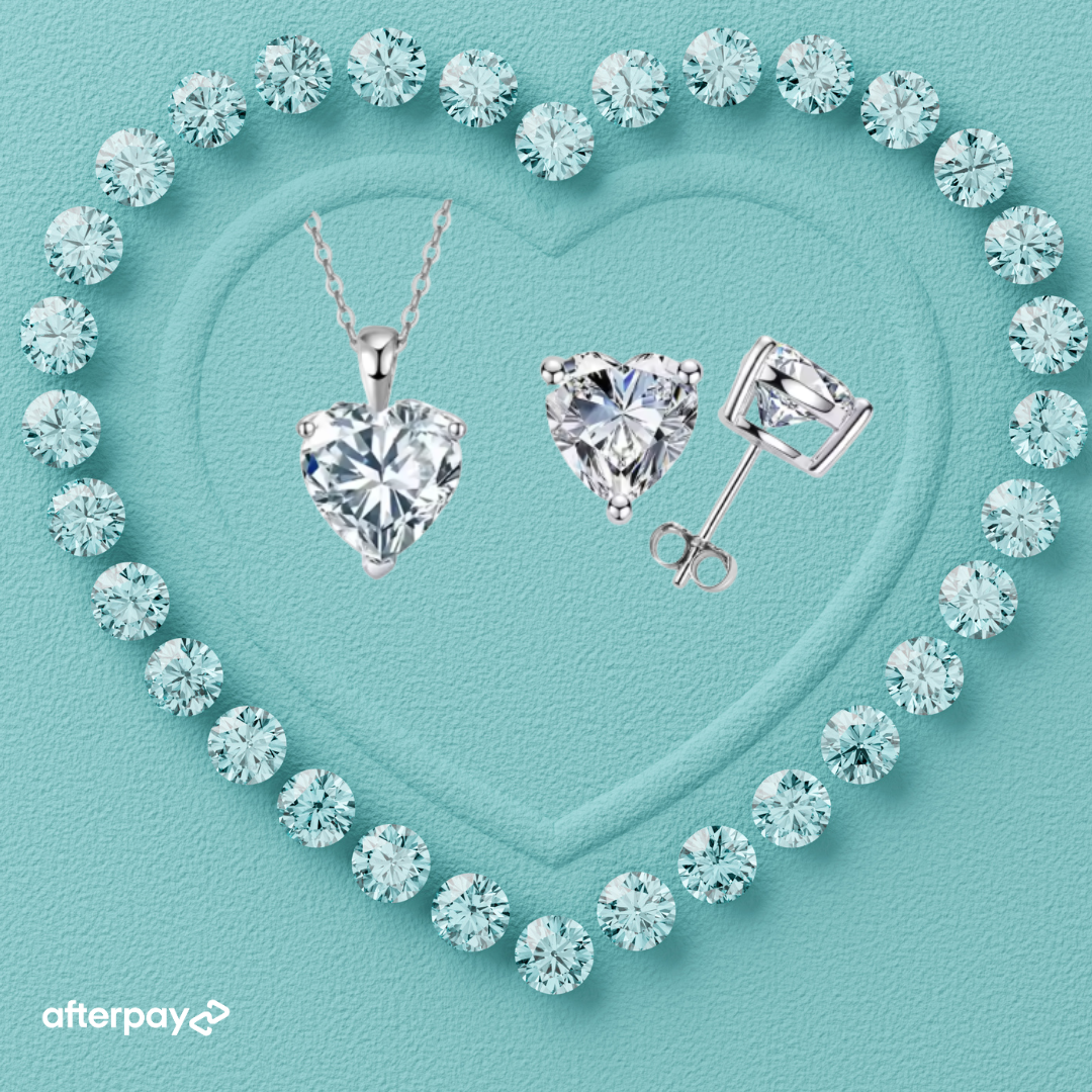 Heart shaped moissanite earrings and pendant set in sterling silver