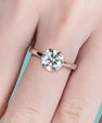 Elegant invisible setting engagement ring with floating centre stone look