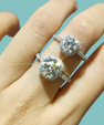 Pavé band moissanite ring with round centre and cushion halo