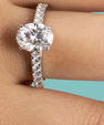 Oval cut moissanite ring with sparkling pavé setting