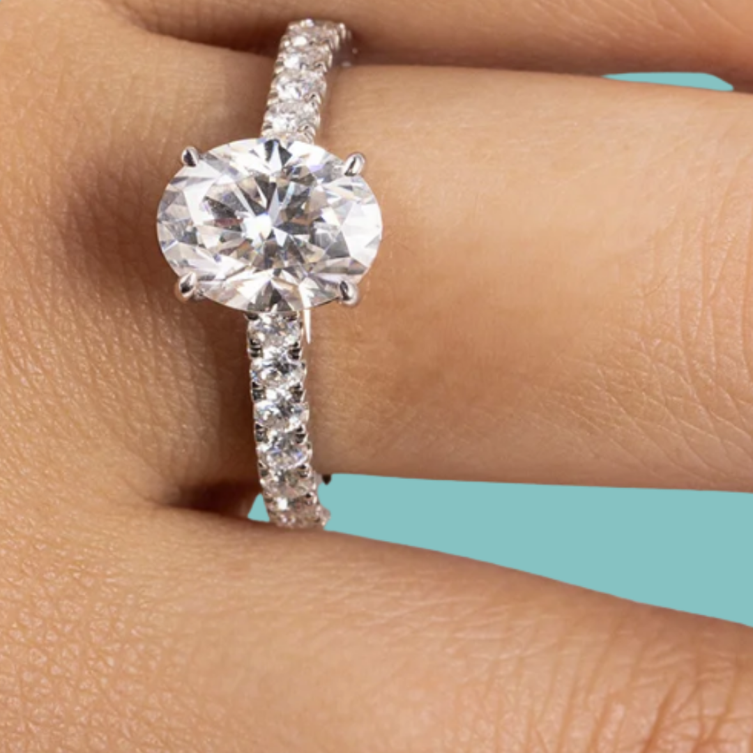 Oval cut moissanite ring with sparkling pavé setting