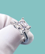 Princess cut moissanite solitaire ring with elegant knife edge band