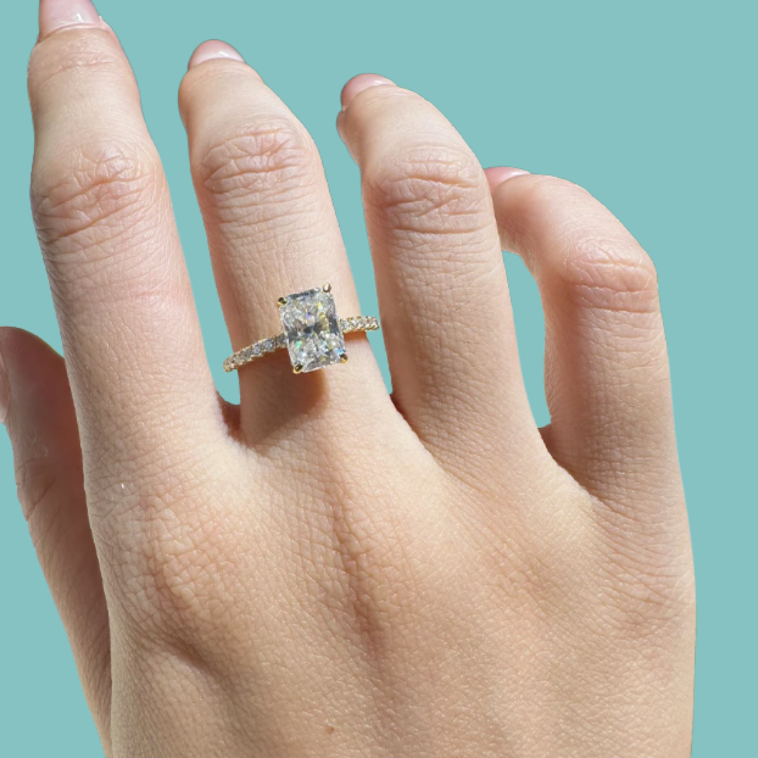 Radiant cut solitaire moissanite ring with sparkling side stones