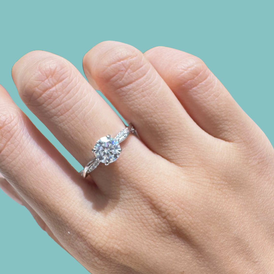 Elegant round moissanite engagement ring with crossover band