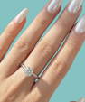 Timeless round moissanite solitaire ring with polished silver tone band