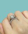 Round cut moissanite engagement ring with matching pavé band