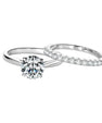 Moissanite bridal set with round solitaire ring and slim pavé band