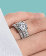 Triple stack moissanite ring set with brilliant round centre stone