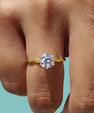 Classic round cut moissanite ring in yellow gold setting
