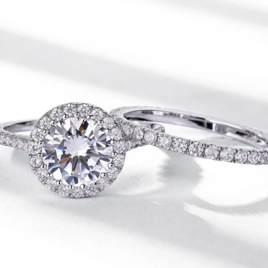 Round halo bridal ring set with sparkling centre stone and matching band