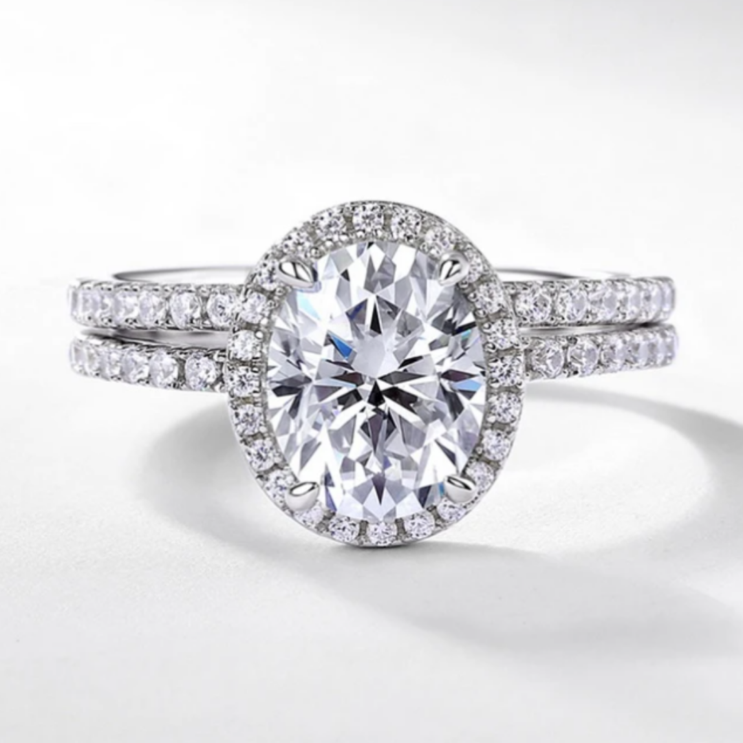 Oval halo bridal ring set with sparkling centre stone and matching band