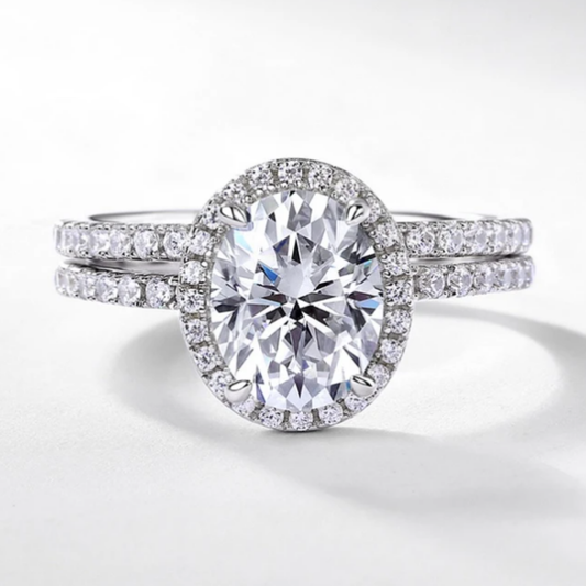 Oval halo bridal ring set with sparkling centre stone and matching band