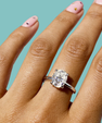 Sterling silver oval moissanite ring set with hidden halo