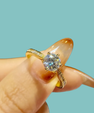 Serena moissanite ring featuring round centre stone and delicate pavé accents
