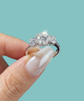 Elegant three stone ring with round centre stone and sparkling side stones