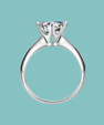 Dainty round moissanite solitaire ring with six claw setting